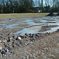 Basetrac Grid partially covered with rubble on a construction site
