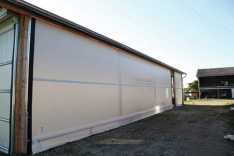 Lubratec Rollofront with installed tubular motor as wind and weather protection of the barn