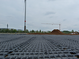 Laid Fortrac geogrid. In the background you can see a wind turbine