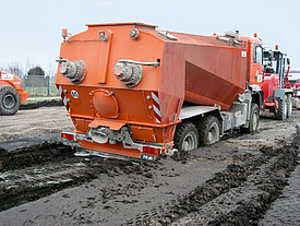 Driving a heavy construction vehicle on soil with low bearing capacity