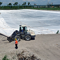 Geosynthetics for sludge pond remediation: reliable cover and preservation of sludge